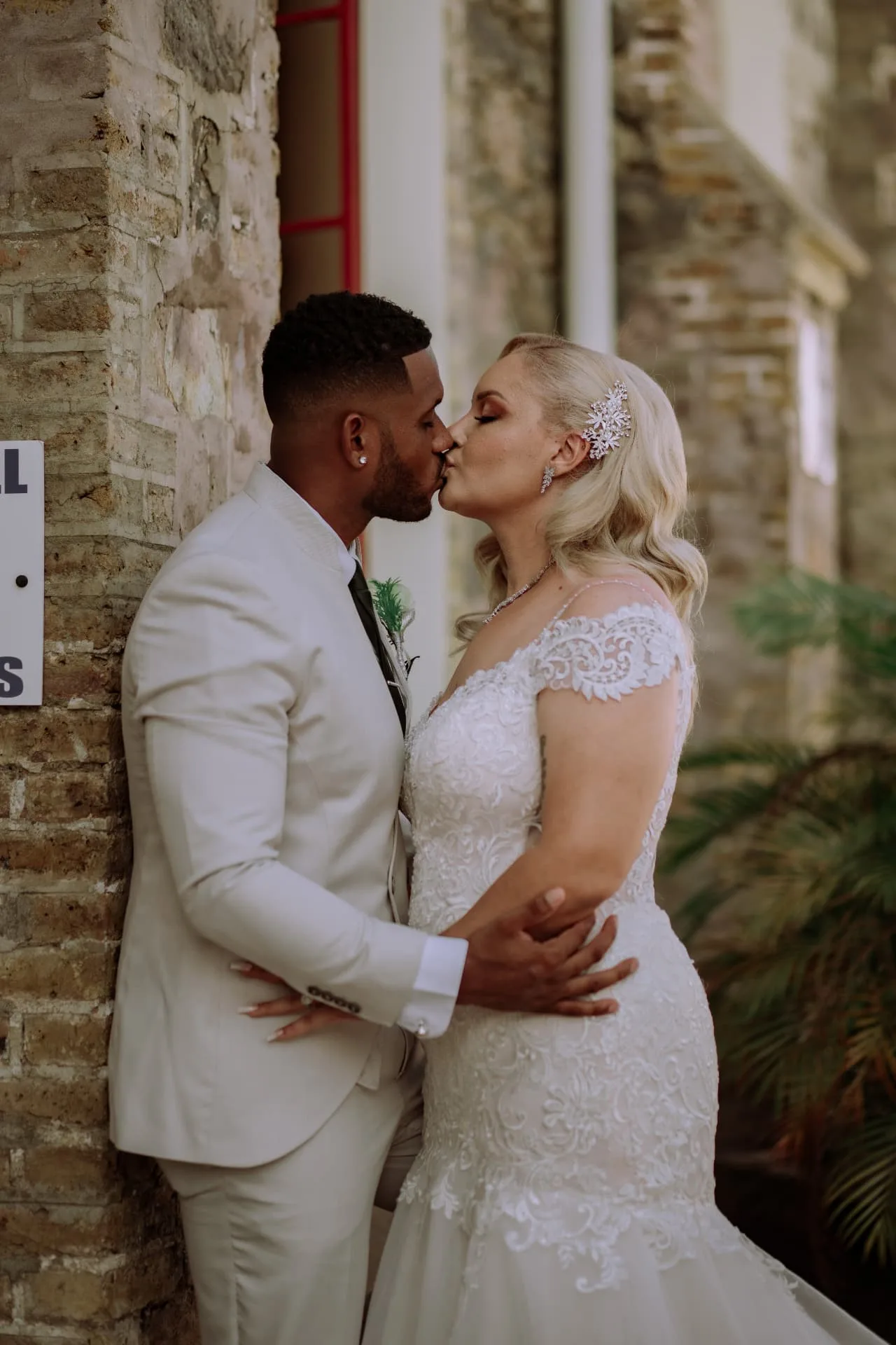 Whitney & Nicholas — A kiss between portraits
