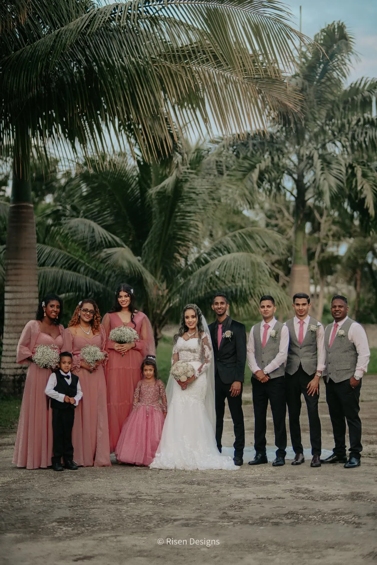 Timothy & Keziah — The full bridal party under the palms