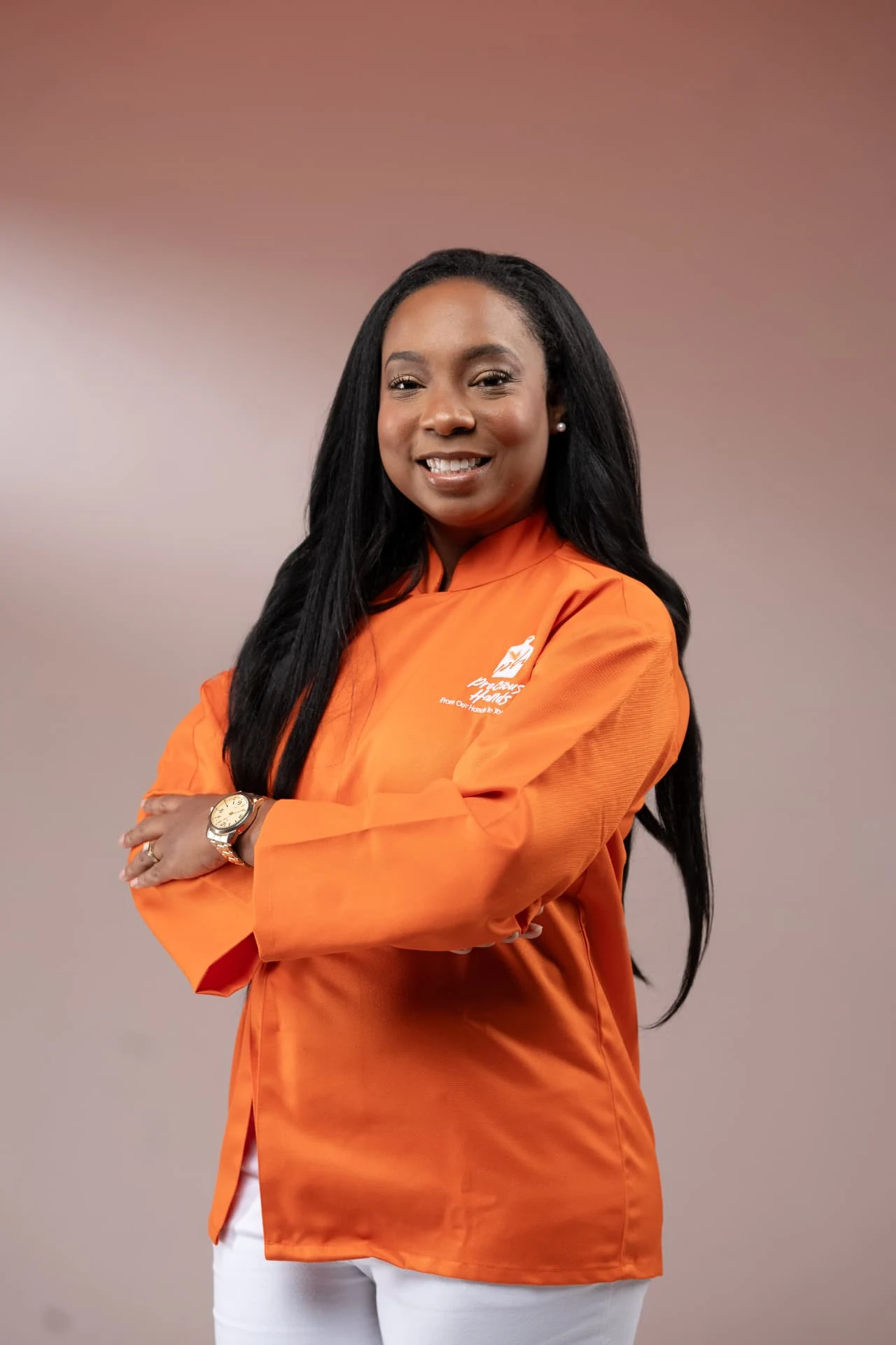 Candace Murray, owner of Precious Hands, in branded chef jacket